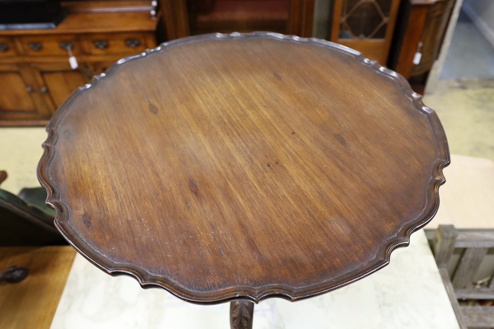 A George III and later circular mahogany piecrust tilt top tripod tea table, diameter 82cm, height 74cm